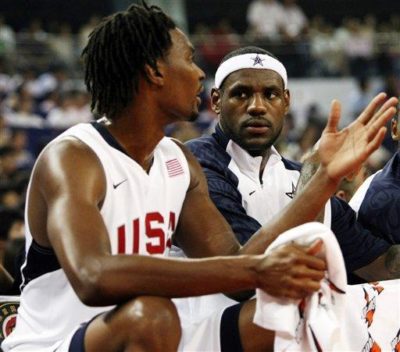 LeBron James and Chris Bosh chat on the bench during a USA men's basketball game during the 2008 Summer Olympics. LeBron will join Bosh and Dwyane Wade with the Miami Heat next season. (AP Photo/Eugene Hoshiko, File)