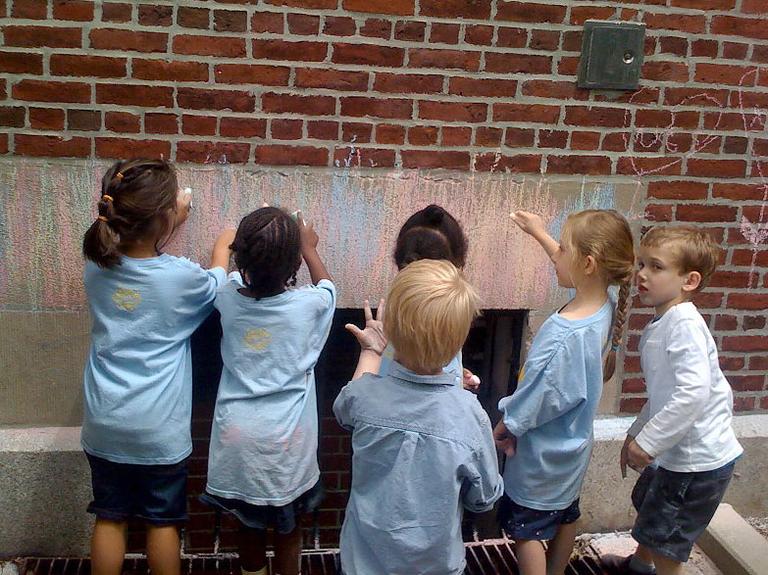 Kindergarten students draw with chalk at Ellis Mendell Elementary School. (Courtesy of Kristin Barrali)