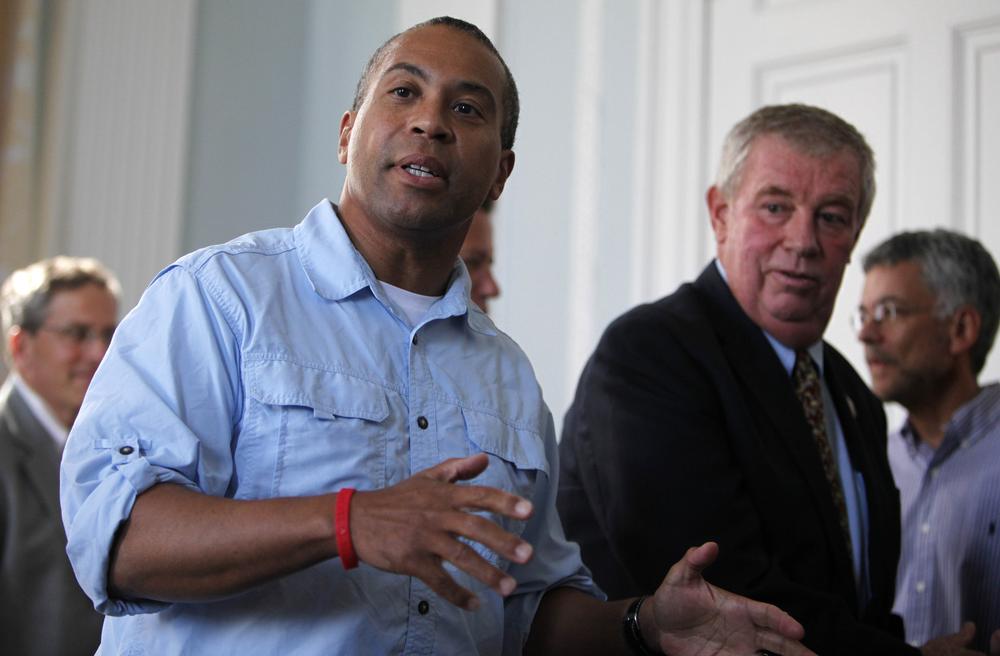 Massachusetts Gov. Deval  Patrick, left, answers a question from reporters about casino gambling as state Rep. Jim Fagan, D-Taunton, second from right, looks on at the Statehouse in Boston, Saturday, July 31, 2010, in Boston. The Massachusetts legislature gave initial approval Saturday to a casino bill that would create the most sweeping expansion of gambling in the state in four decades, even as Gov. Patrick vowed not to sign the measure. (AP)
