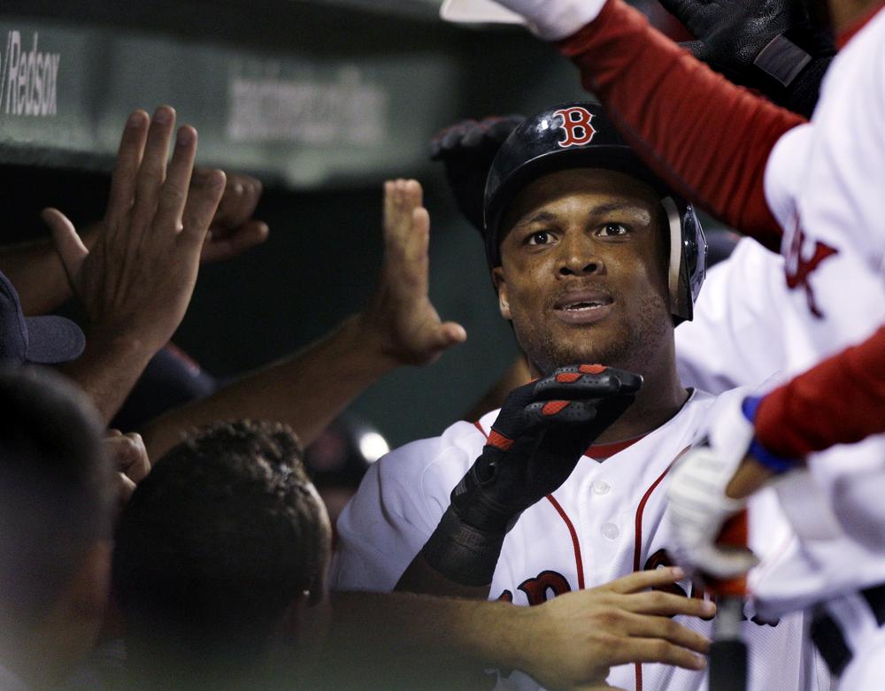 Boston's Adrian Beltre is congratulated by teammates after his three-run home run against Cleveland during the eighth inning of the game in Boston on Monday. (AP)