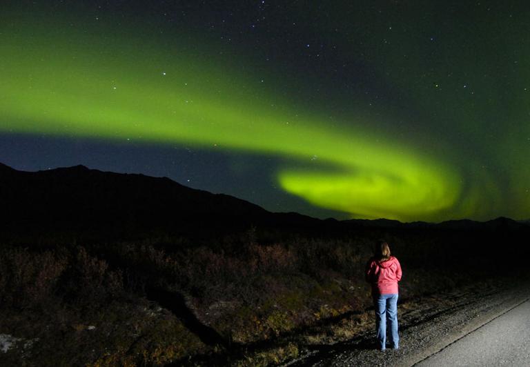 A spectator watches the Northern Lights in Denali National Park in Alaska. (AP)