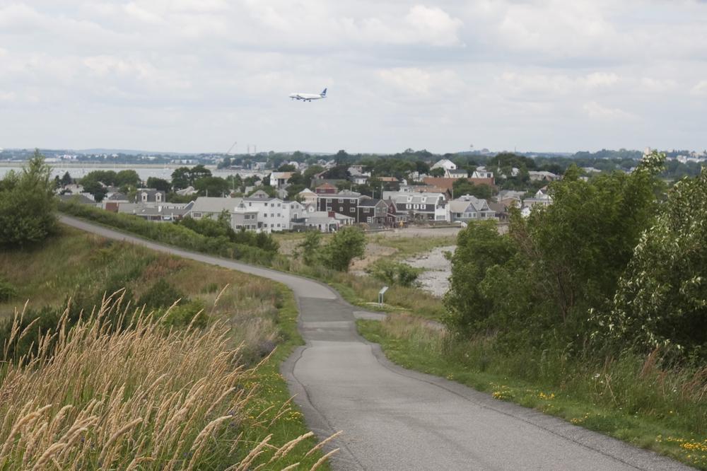 A plane flies low over Winthrop, House Speaker Robert DeLeo's hometown. (Jess Bidgood for WBUR)