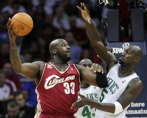 Former Cleveland Cavaliers&#039; player Shaquille O&#039;Neal (33) tries to pass around Boston Celtics&#039; Kevin Garnett during an NBA basketball game in Cleveland in 2009. The Boston Celtics this week signed former rival Shaquille O&#039;Neal. (AP)