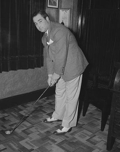 Hollywood golfer John Montague, whose real name is LaVerne Moore, grips a club in the Los Angeles County jail, July 10, 1937, a day after his arrest on a seven-year-old robbery in New York.  (AP)