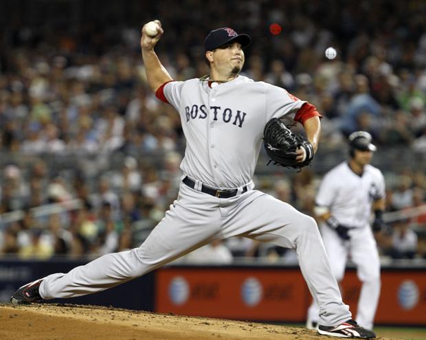 Boston starting pitcher Josh Beckett delivers in the first inning against New York Yankees the game at Yankee Stadium on Sunday in New York. (AP)