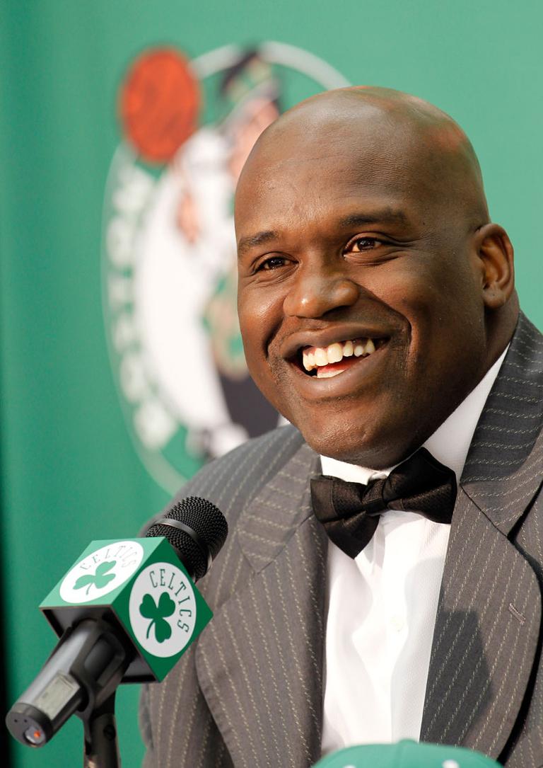 Newly signed Boston Celtic Shaquille O&#39;Neal smiles at a news conference on Tuesday in Waltham. (AP)