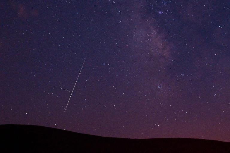 A meteor streaks across the sky during the Perseid meteor shower on Aug. 11, 2009 in Vinton, Calif. (AP)