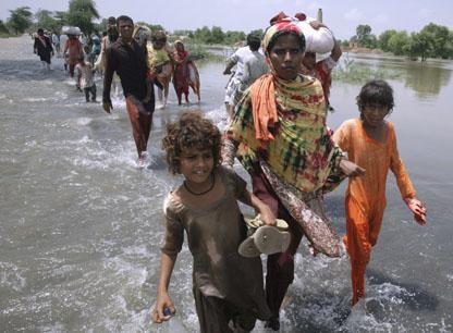 Pakistani villagers flee their homes due to heavy flooding in central Pakistan on Wednesday, Aug. 11, 2010. Pakistan estimates 13.8 million people are affected by the floods and will need short-term aid or long-term assistance to recover. (AP)