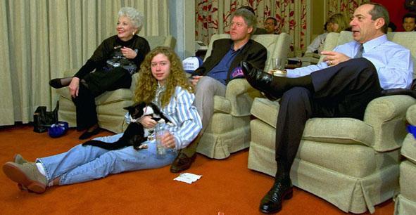 President Clinton, flanked by Govs. Ann Richards and Mario Cuomo, watches the Super Bowl with his daughter, Chelsea, in the White House&#039;s family theater during his presidency. (AP)