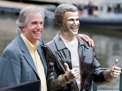 Henry Winkler with a statue in honor of his &#039;Happy Days&#039; character Fonzie. (elviskennedy/Flickr)