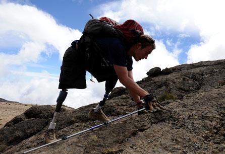 Neil Duncan makes his way slowly towards the summit of Mt Kilimanjaro in Tanzania, on the fourth day of his climb. Duncan lost his legs in Afghanistan. (AP/Courtesy of Disabled Sports USA)