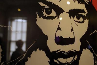 A vintage concert poster depicting late US musician Jimi Hendrix, is seen in a exhibition at the Handel House Museum. (AP)