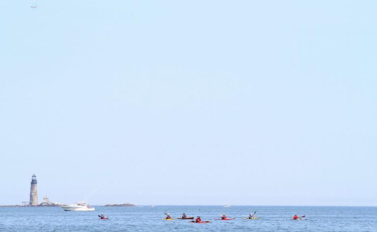 Kayakers and boaters out on Boston Harbor (Andrew Phelps/WBUR)