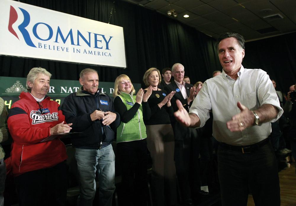 Mitt Romney reacts as he enters a town meeting in Manchester, N.H. (AP)
