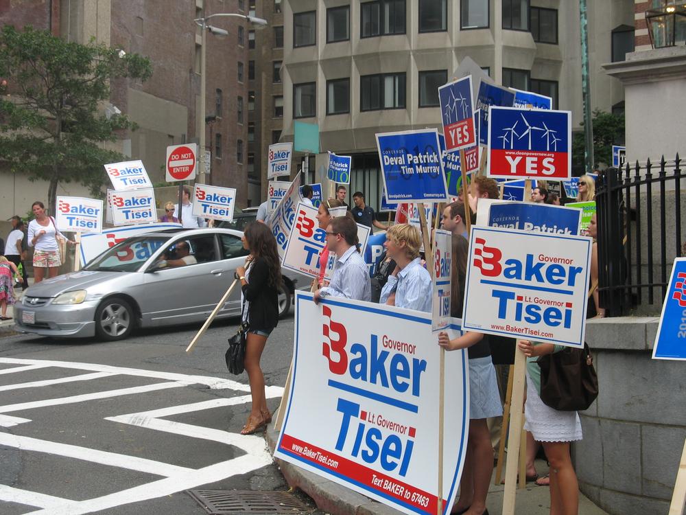 Cape Wind supporters join the usual pack of campaign volunteers outside of Monday&#39;s gubernatorial debate at Suffolk University. (Martha Bebinger/WBUR)