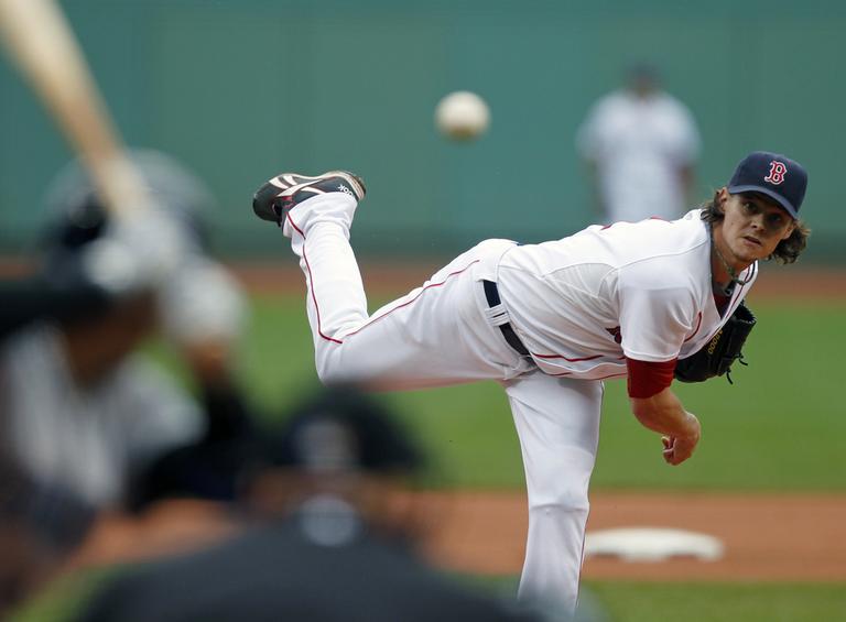 Clay Buchholz pitches in the first inning of a baseball game against the Toronto Blue Jays in Boston on Sunday. (AP)