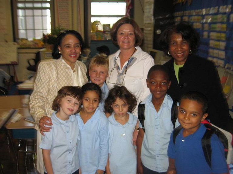 Boston Public Schools Superintendent Dr. Carol R. Johnson (left) meets students and their teacher and principal at the Bates Elementary School. (Christopher Horan/Wikimedia)