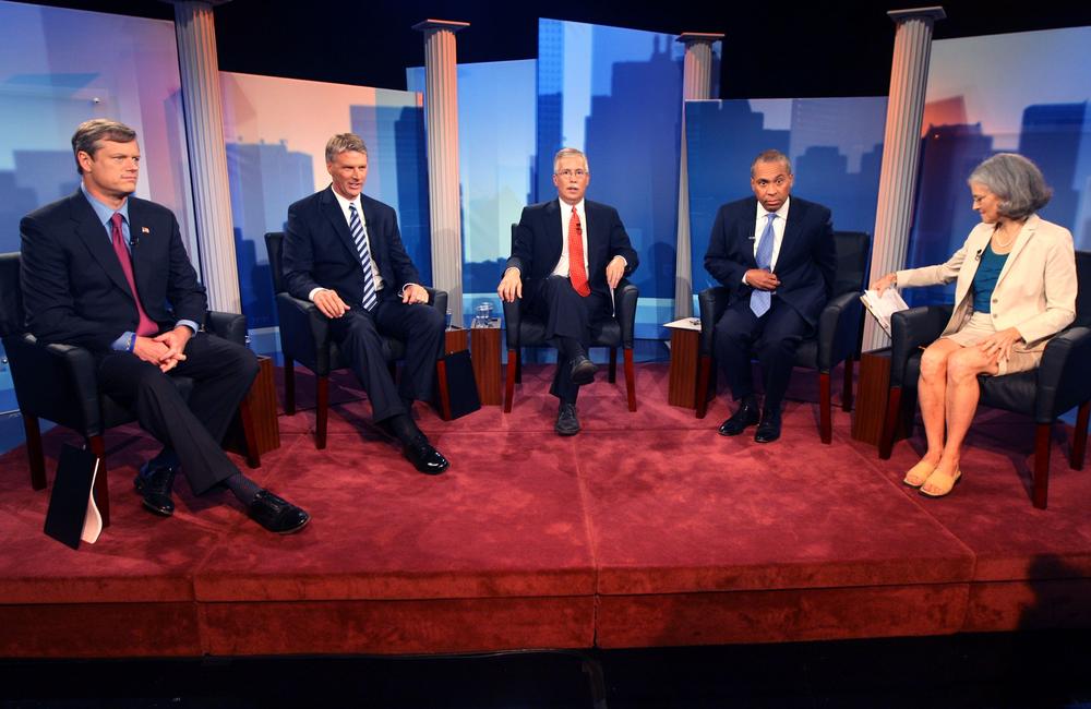 Massachusetts Republican gubernatorial candidate Charles D. Baker, left, independent Timothy Cahill, second left, moderator and political analyst Jon Keller, center, Gov. Deval Patrick, second right, and Green-Rainbow Party candidate Jill Stein, right, prepare for the first televised debate. (AP)