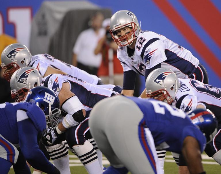 New England Patriots' Tom Brady, center, during an NFL preseason game against the New York Giants. (AP)