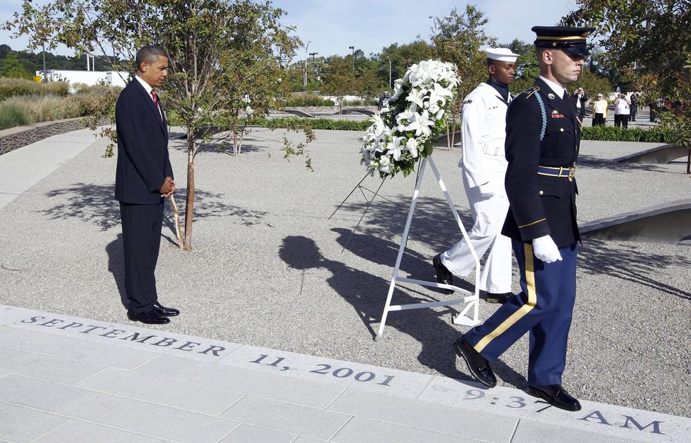 President Barack Obama lays a wreath at the Pentagon Memorial, marking the ninth anniversary of the September 11 attacks. (AP Photo/Charles Dharapak)