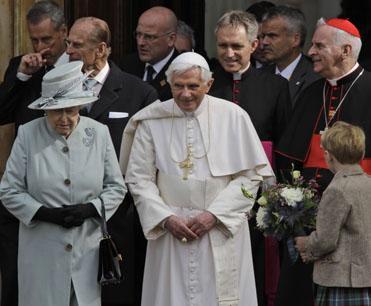 Britain's Queen Elizabeth II, left, accompanies Pope Benedict XVI, center, as he leaves the Palace of Holyroodhouse, in Edinburgh, Scotland, Thursday Sept. 16, 2010. (AP)