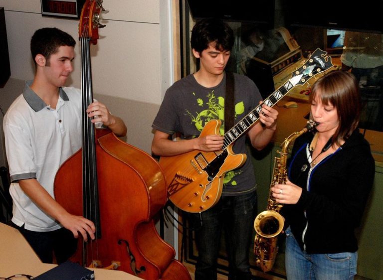 Greg Chaplin, left, Kenji Herbert, and Hailey Niswanger, from the Berjlee Global Jazz Institute. (Jessica Alpert/WBUR)