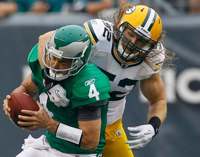 Philadelphia Eagles quarterback Kevin Kolb, left, is sacked by Green Bay Packers linebacker Clay Matthews. (AP)