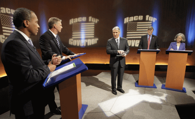CNN's John King, center, explains the rules to, left to right, Democratic Gov. Deval Patrick, independent Timothy Cahill, Republican Charles Baker and Green-Rainbow Party candidate Jill Stein before a gubernatorial debate in Boston on Tuesday. (AP)