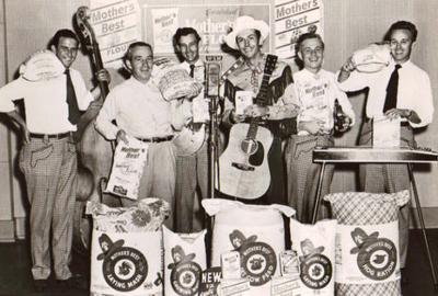 Hank Williams with his band, and bags of sponsor's Mother's Best flour. (Courtesy of Missing Piece Group)