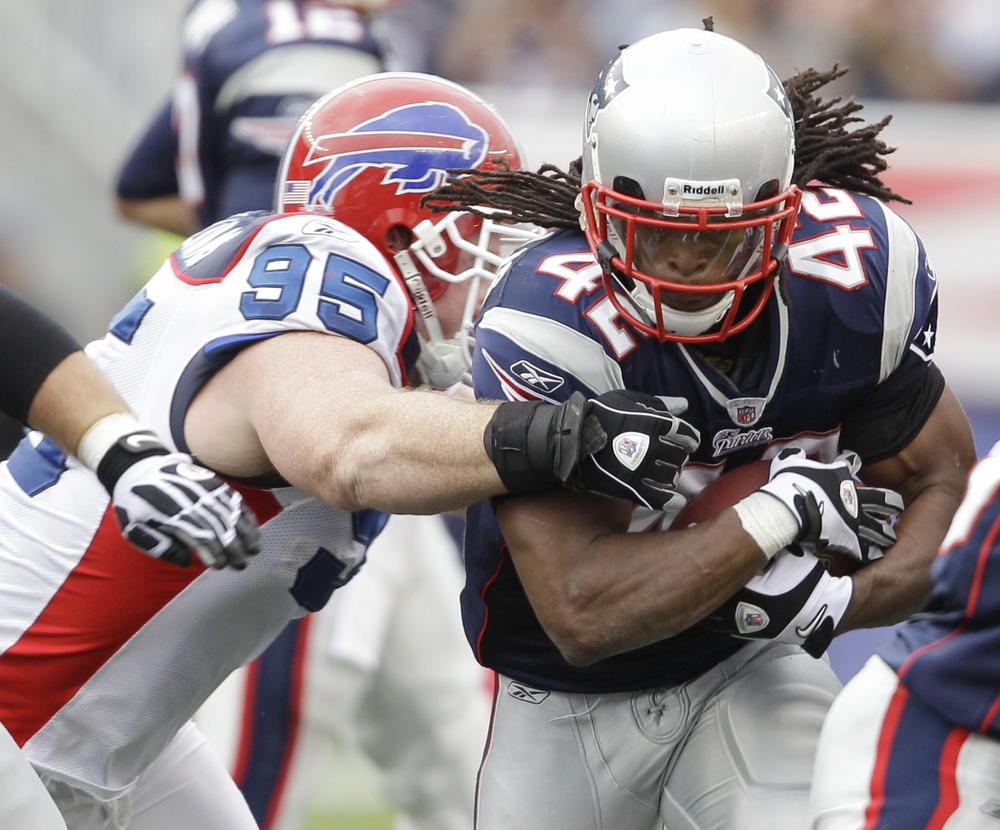 New England Patriots running back BenJarvus Green-Ellis (42) finds a hole to run through during an NFL football game against the Buffalo Bills in Foxborough, Mass. on Sunday. (AP)