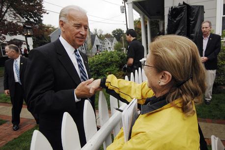 Vice President Joe Biden shakes hands along a Manchester, N.H., street. (AP)