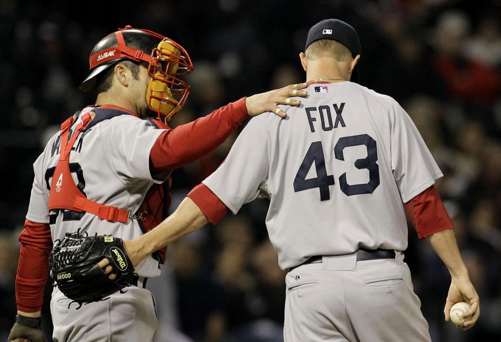 Boston Red Sox catcher Jason Varitek, left, talks with relief pitcher Matt Fox as the Sox slid out of the playoffs. (AP)