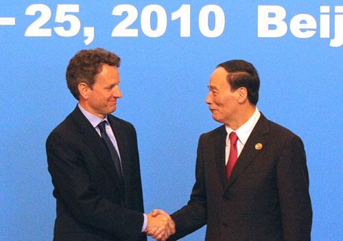 U.S. Treasury Secretary Timothy Geithner, left, is greeted by Chinese Vice Premier Wang Qishan in Beijing, May 2010. (AP)
