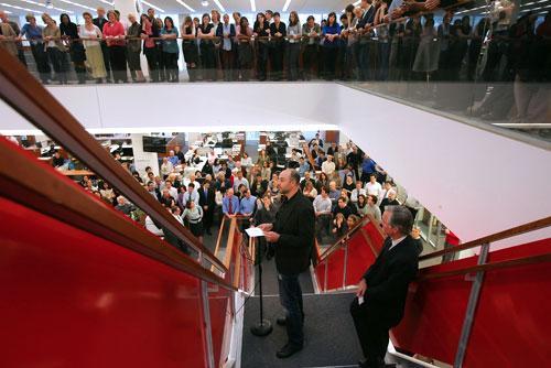 New York Times executive editor Bill Keller, bottom right, at the Times building, beside photographer Damon Winter, center, 2009. Winter had just won the Pulitzer Prize. (AP)