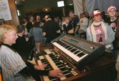 Chicago White Sox organist Nancy Faust plays for fans at a local bar to celebrate the team&#039;s 2005 World Series title. Faust will retire after this season, her 41st year with the White Sox.