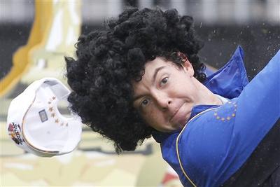 Unfortunately, Rory McIlroy won&#039;t be wearing this curly wig when he tees off Friday with European teammate Graeme McDowell against Americans Stewart Cink and Matt Kuchar in the Ryder Cup. (AP Photo/Jon Super)