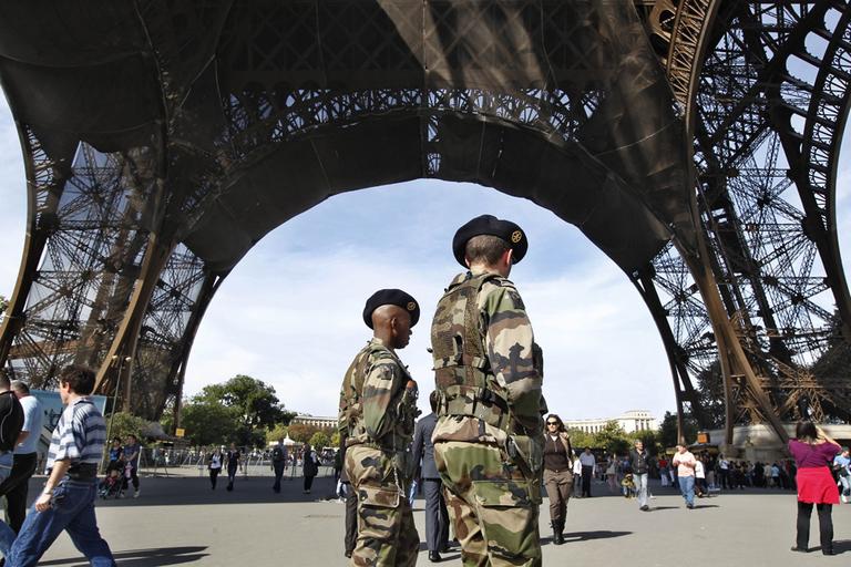 French soldiers patrol under the Eiffel Tower in Paris on Sunday. (AP)