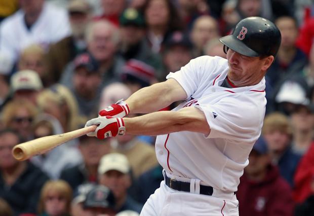 Boston's J.D. Drew hits a two-run home run in the first inning of the game against New York on Sunday in Boston. (AP)