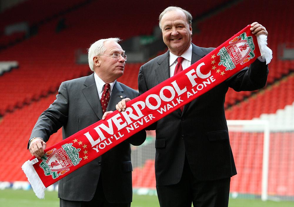 In this Tuesday Feb. 6, 2007 file photo Liverpool's new owners American businessmen George Gillett Jr., left, and Tom Hicks, right, pose for photographers in front of the club's Kop stand at Anfield Stadium, Liverpool, England, after taking control of the club.  (AP)