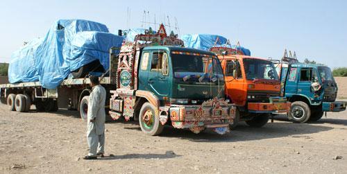 Afghanistan-bound NATO trucks at a roadside as authorities blocked NATO supply line to Afghanistan after NATO allegedly killed three border guards at Pakistani border, Sept. 30, 2010. (AP)