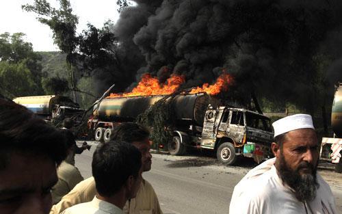 Burning NATO trucks in Khairabad near Peshawar, Pakistan, Oct. 7, 2010. Gunmen torched tankers carrying fuel to NATO troops. (AP)