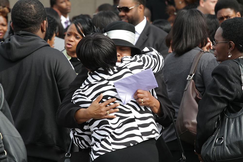 Mourners gathered outside Jubilee Baptist Church in Mattapan on Monday after the funeral for Lavaughn Washum-Garrison. (Andrew Phelps/WBUR)