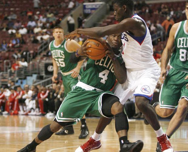 Boston's Nate Robinson drives against Philadelphia's Jrue Holiday during the first half of the game on Tuesday in Philadelphia. The 76ers won 103-92. (AP)