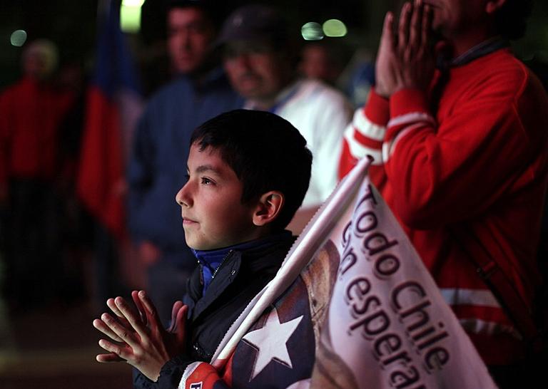 A boy watches the rescue operations at the San Jose mine in Chile. (AP)