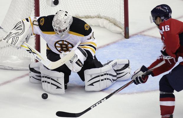 Boston Bruins goalie Tim Thomas (30) blocks a shot by Washington Capitals right wing Eric Fehr (16) during the third period of an NHL hockey game in Washington, Tuesday, Oct. 19, 2010. The Bruins won 3-1. (AP)
