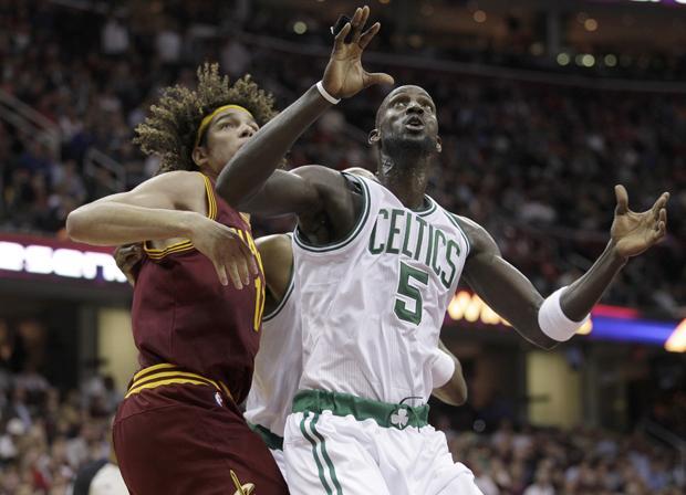 Boston's Kevin Garnett (5) and Cleveland's Anderson Varejao look for a rebound in the game on Wednesday in Cleveland. (AP)