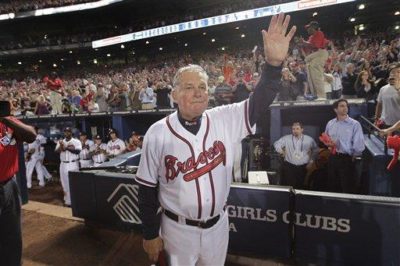 Atlanta Braves manager Bobby Cox waves goodbye to fans after his team was eliminated from the playoffs by the San Francisco Giants on Monday, Oct. 11, 2010, in Atlanta. Cox is retiring. (AP Photo/Dave Martin)