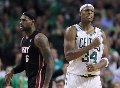 Boston Celtics forward Paul Pierce pumps his fist as Miami Heat forward LeBron James walks past during the second half of the Celtics' 88-80 victory Tuesday night. 