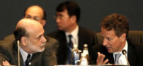 U.S. Treasury Secretary Timothy Geithner, right, talks with Federal Reserve Chairman Ben Bernanke, Oct. 22, 2010. (AP)