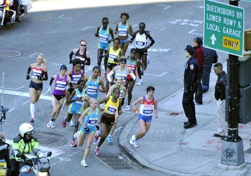 The elite women runners make the turn the corner of 59th Street during the New York City Marathon, Nov. 7, 2010. (AP)